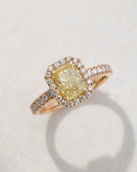 Ring in 18K Rose Gold with Radiant Fancy Yellow Diamond and Brilliant Cut Diamonds