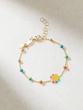 18K Yellow Gold Bracelet with Multicolor Beads and Enamel Flower