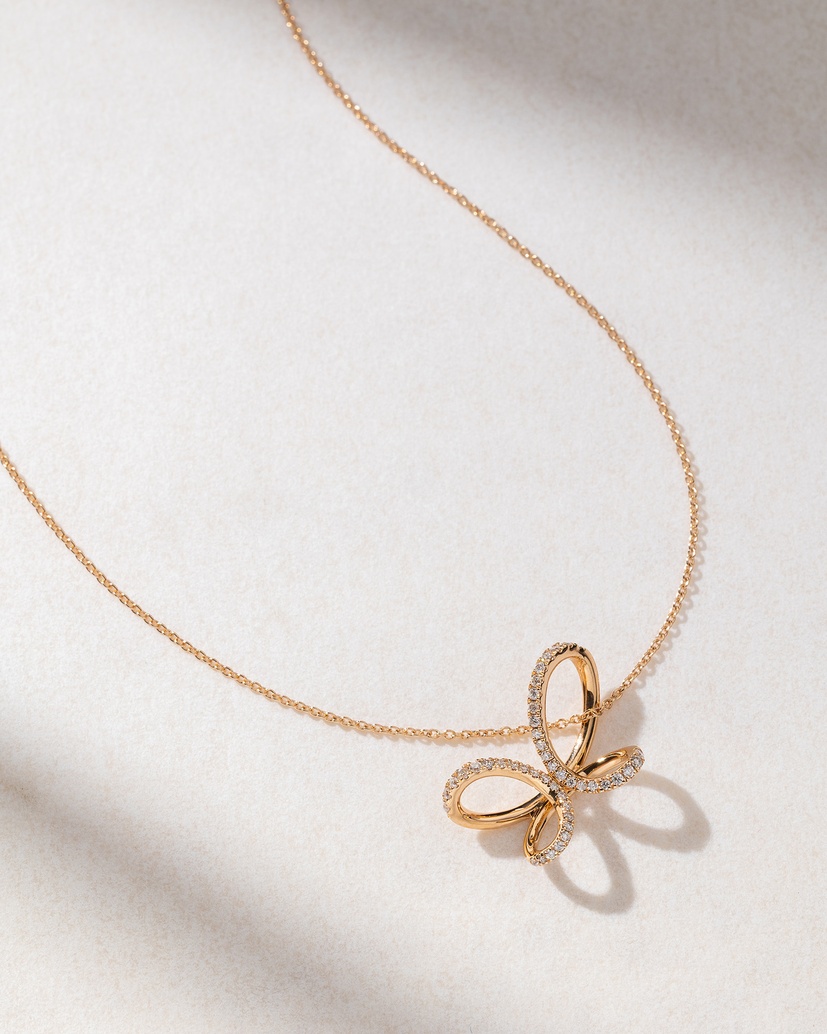 18K Rose Gold Necklace with Diamonds and a Ribbon design - Image 1