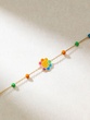 18K Yellow Gold Bracelet with Multicolor Beads and Enamel Flower