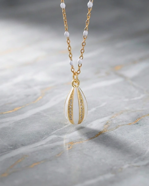 Gold-Plated Egg Necklace with White and Gold Enamel and White Stones