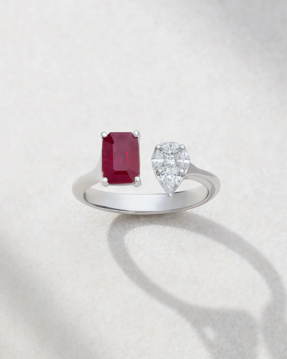 Ring in 18K White Gold with Pear, Marquise and Princess Cut Diamonds and an Emerald Cut Ruby